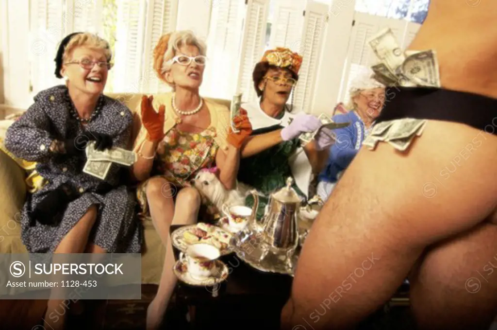 Three senior women watching a male stripper
