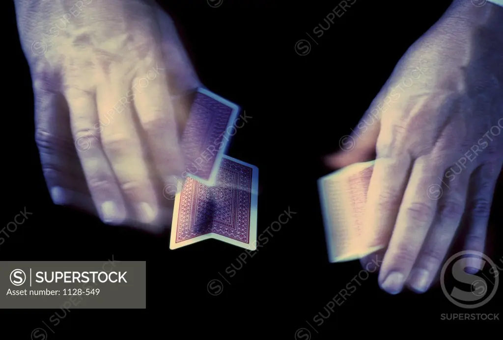 Person shuffling playing cards