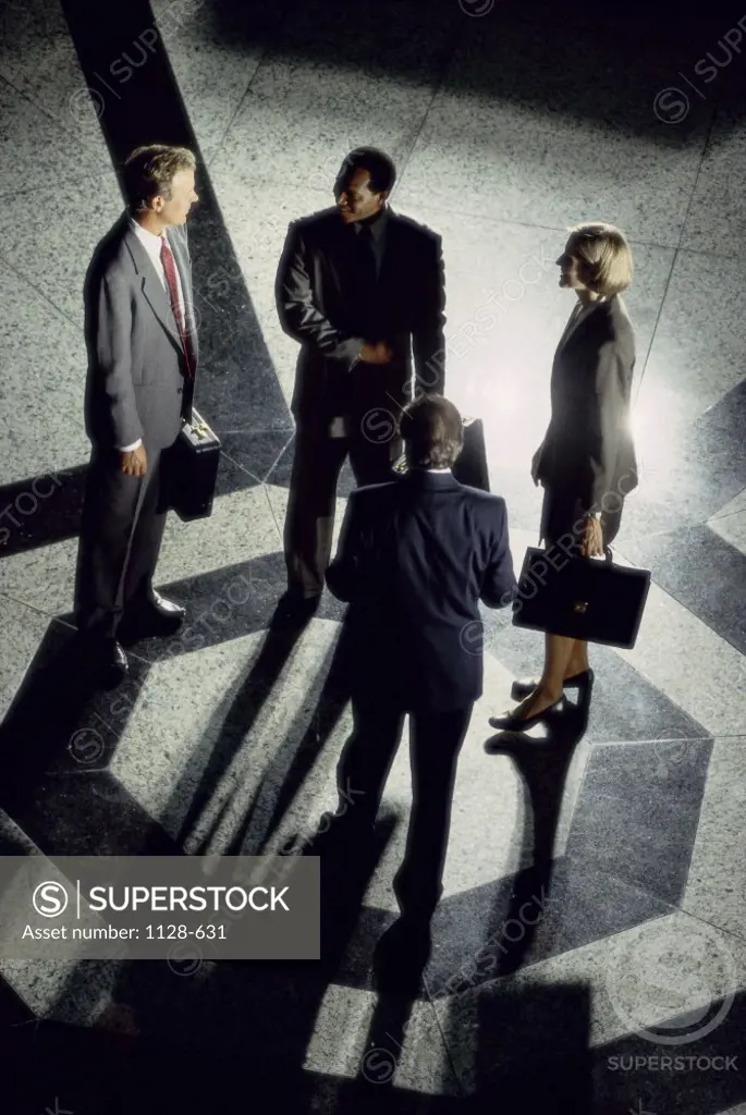 High angle view of business executives standing together talking