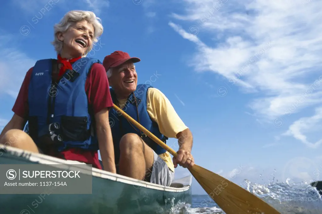 Senior couple in a row boat