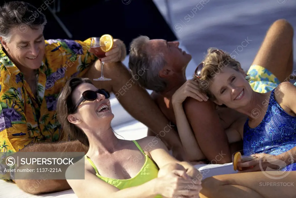 Two couples together on a boat