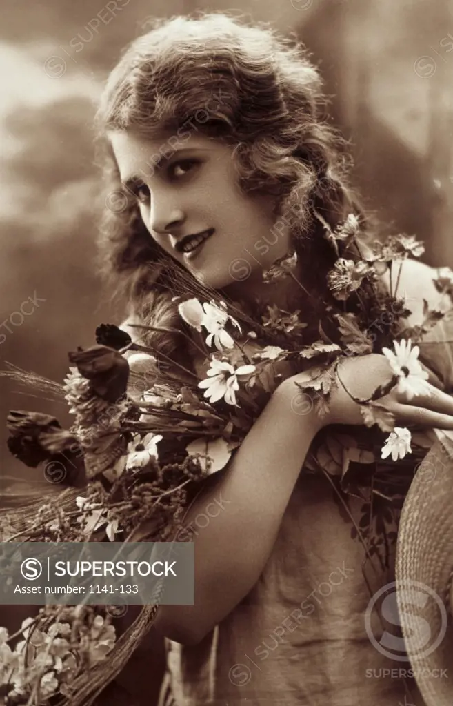 Close-up of a young woman holding a bouquet
