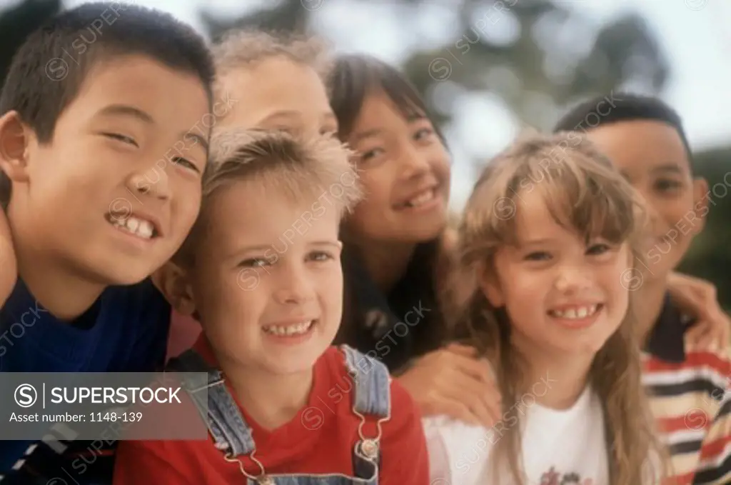 Close-up of a group of boys and girls smiling