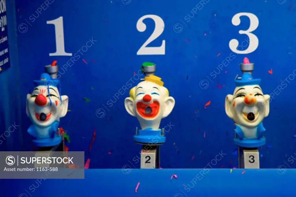 Clown faces in an amusement park