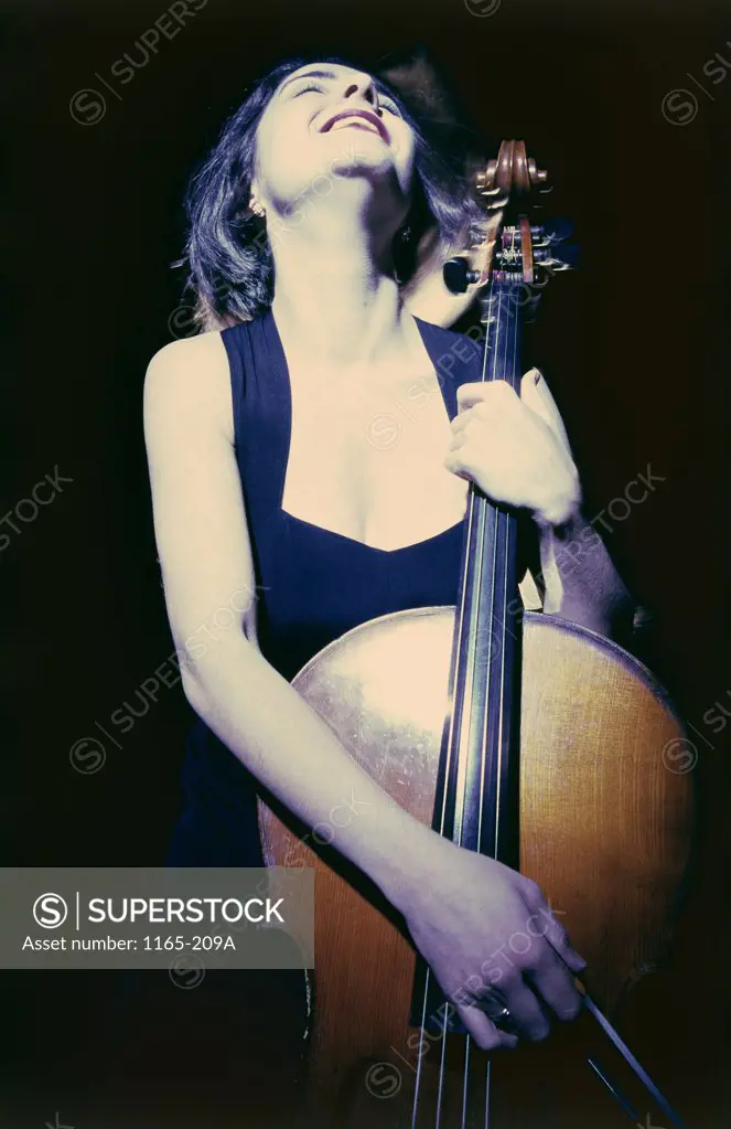 Low angle view of a female cellist playing a cello