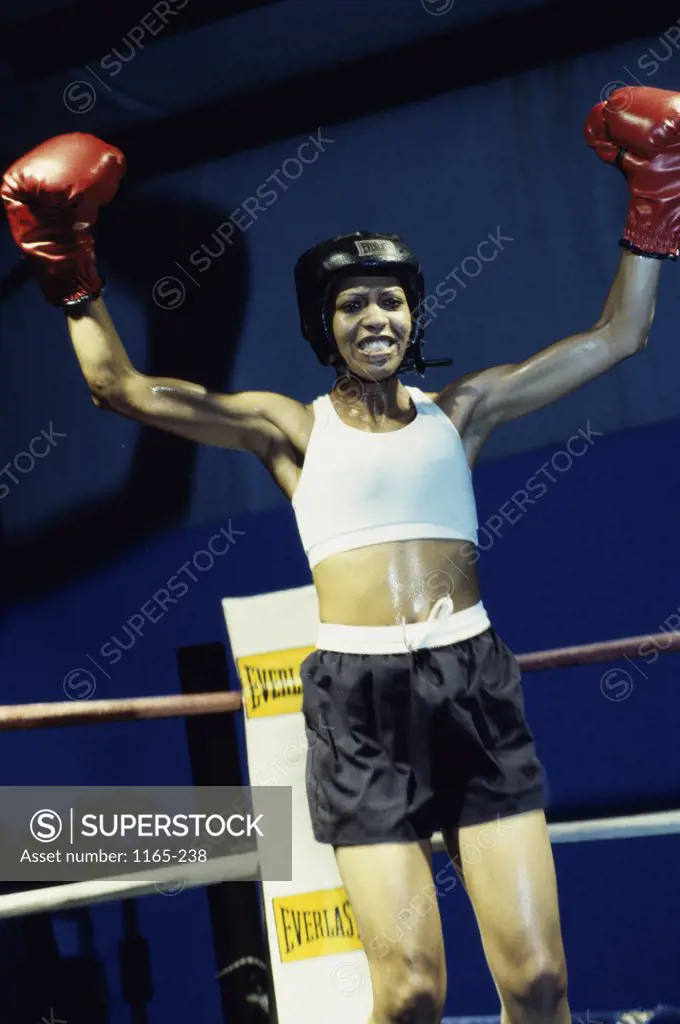 Young woman standing in a boxing ring