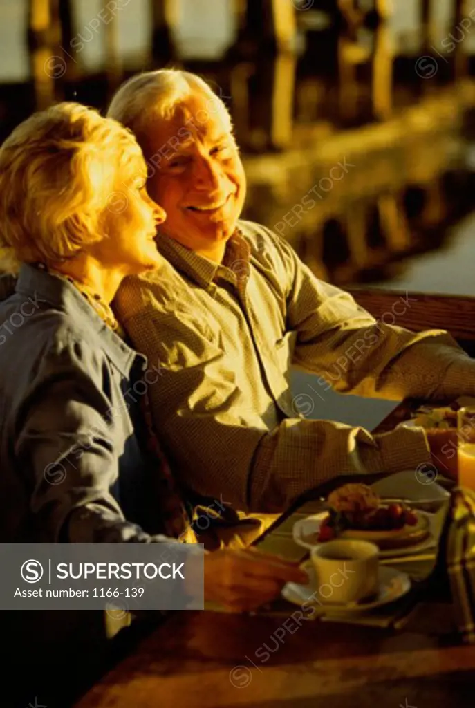 Side profile of a senior couple sitting in a restaurant