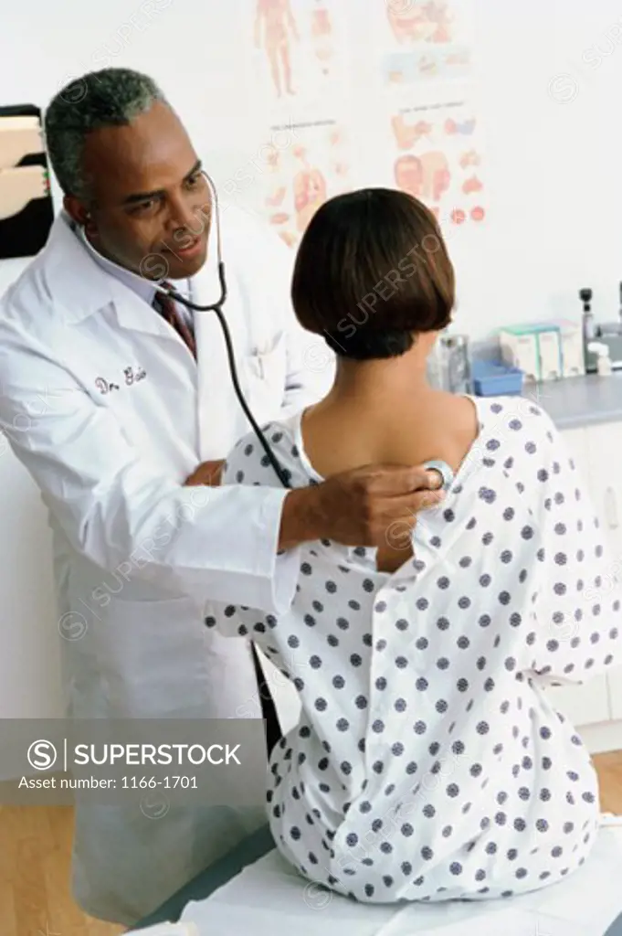 Male doctor examining a female patient