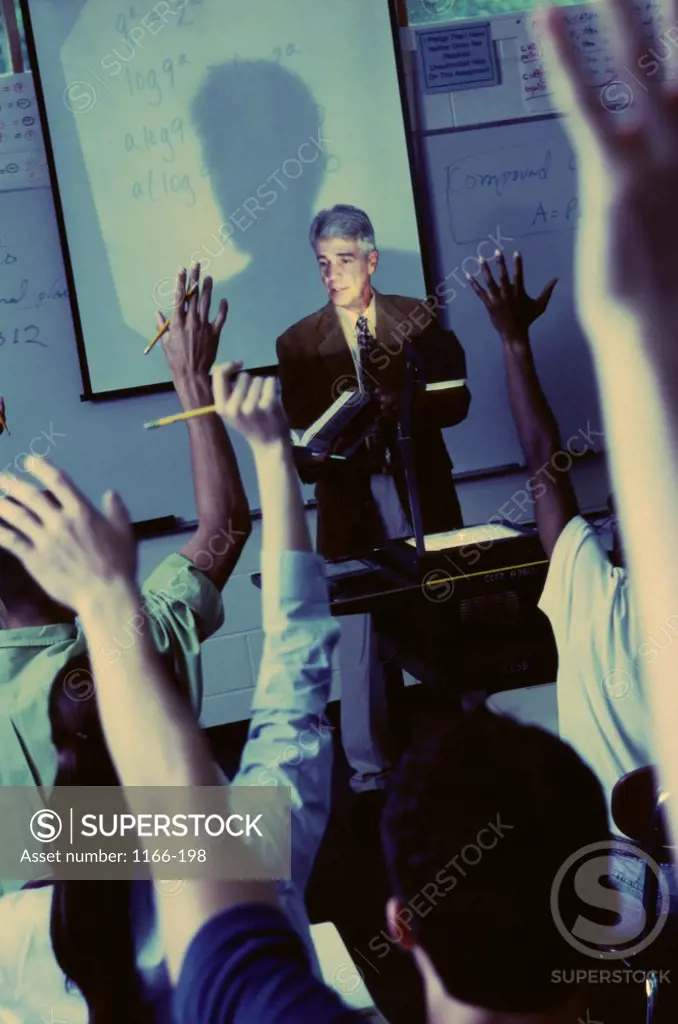 Teacher explaining with the help of an overhead projector