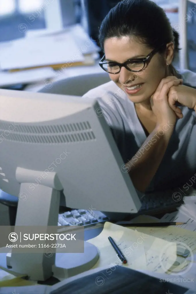 Businesswoman sitting in front of a computer monitor