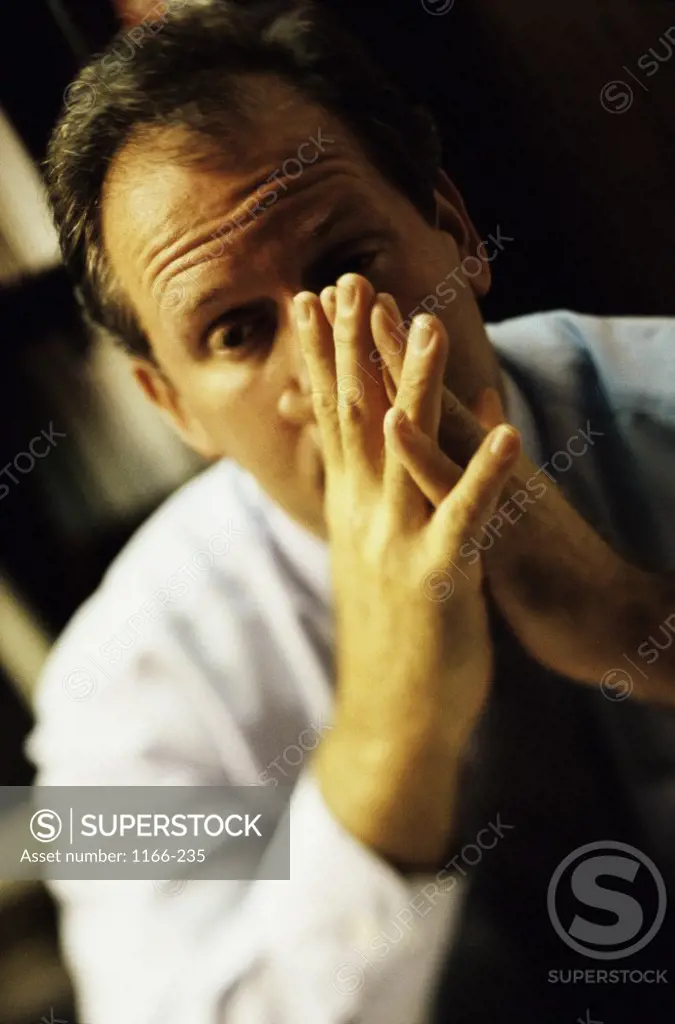 Businessman with his hands against his face