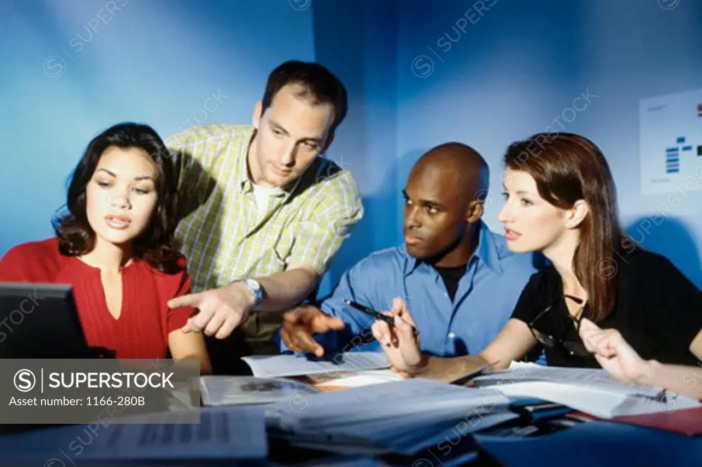 Two businessmen and two businesswomen in a meeting