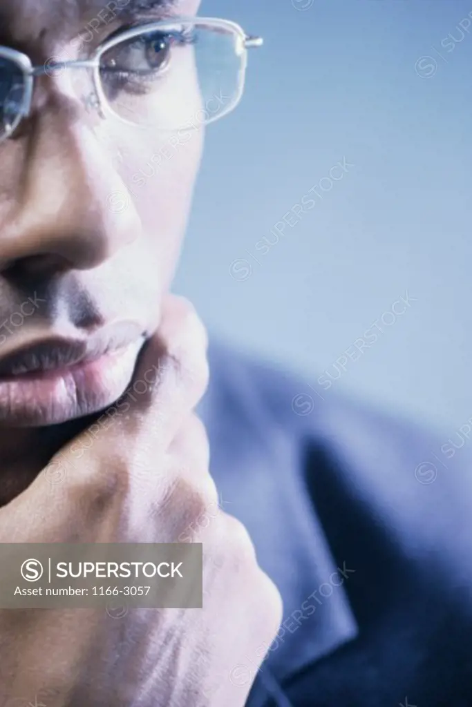 Close-up of a businessman with his hand on his chin
