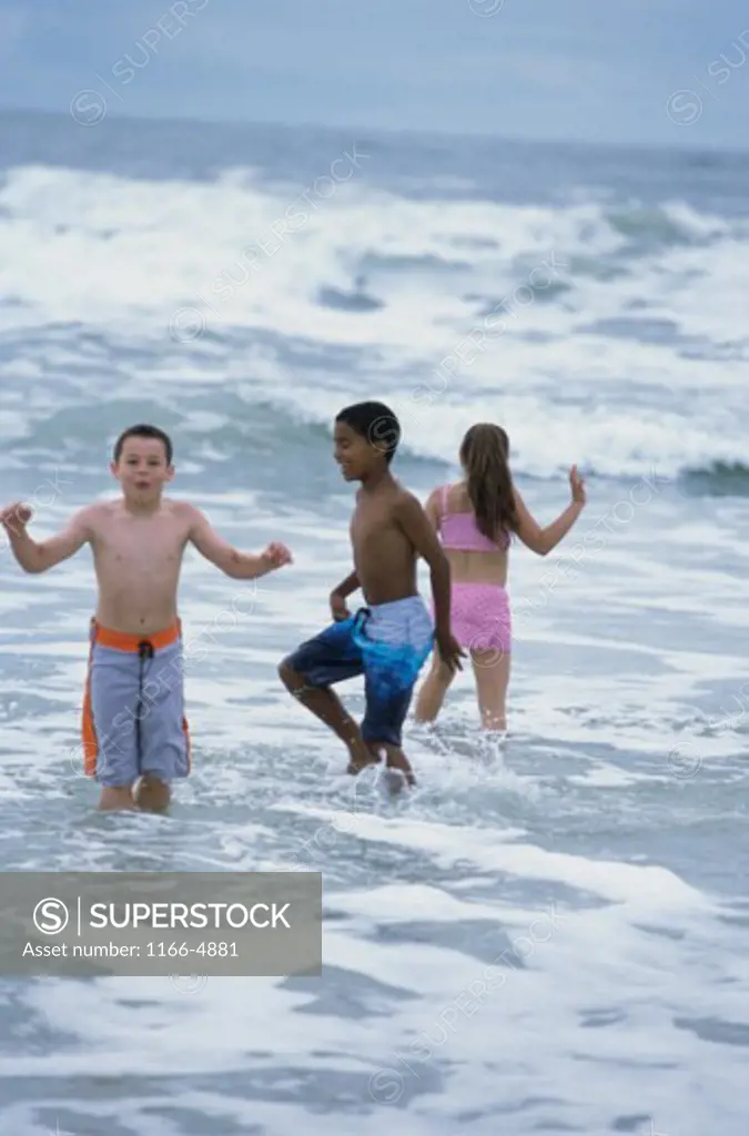Two boys and a girl on the beach