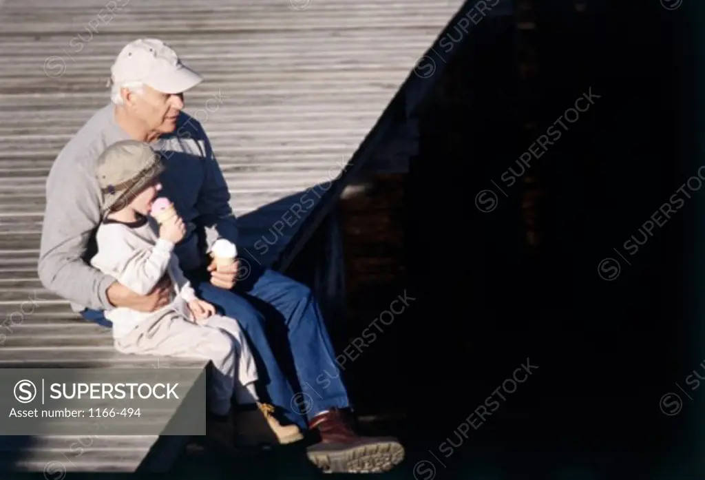 Grandfather sitting with his grandson