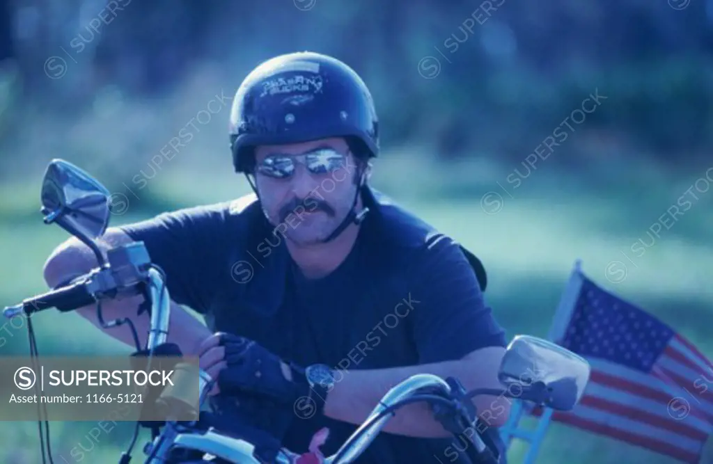Portrait of a young man on a motorcycle