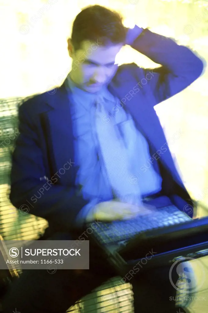 Businessman sitting with a laptop