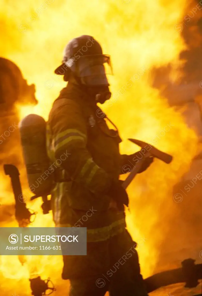 Side profile of a firefighter holding an axe