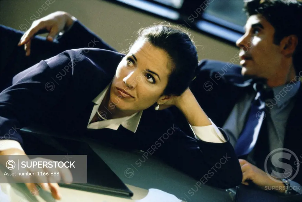 Businesswoman and a businessman in an office