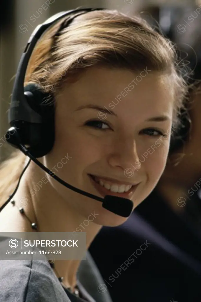 Portrait of a businesswoman wearing a headset smiling