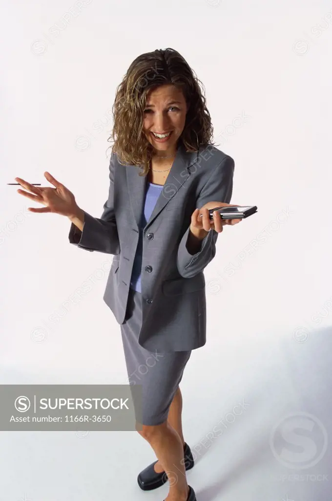 Portrait of a young businesswoman holding a hand held device