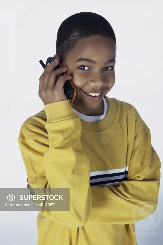 Portrait of a boy talking on a mobile phone