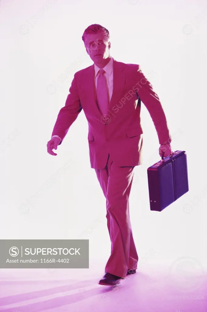 Businessman walking holding a briefcase