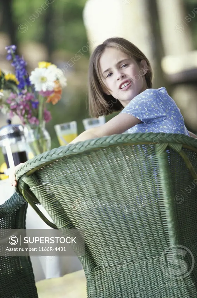 Portrait of a girl sitting at a table
