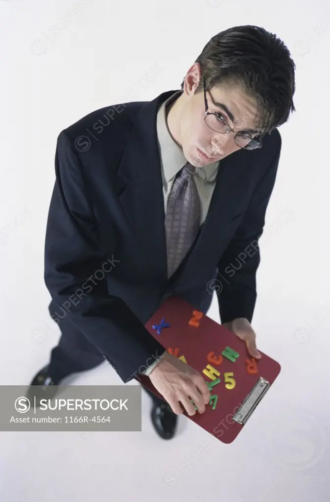 High angle view of a businessman holding a clipboard
