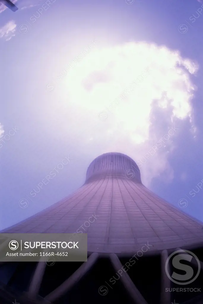 Low angle view of a smoke stack at a power plant