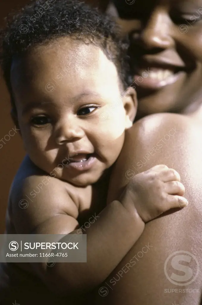 Close-up of a mother holding her baby boy