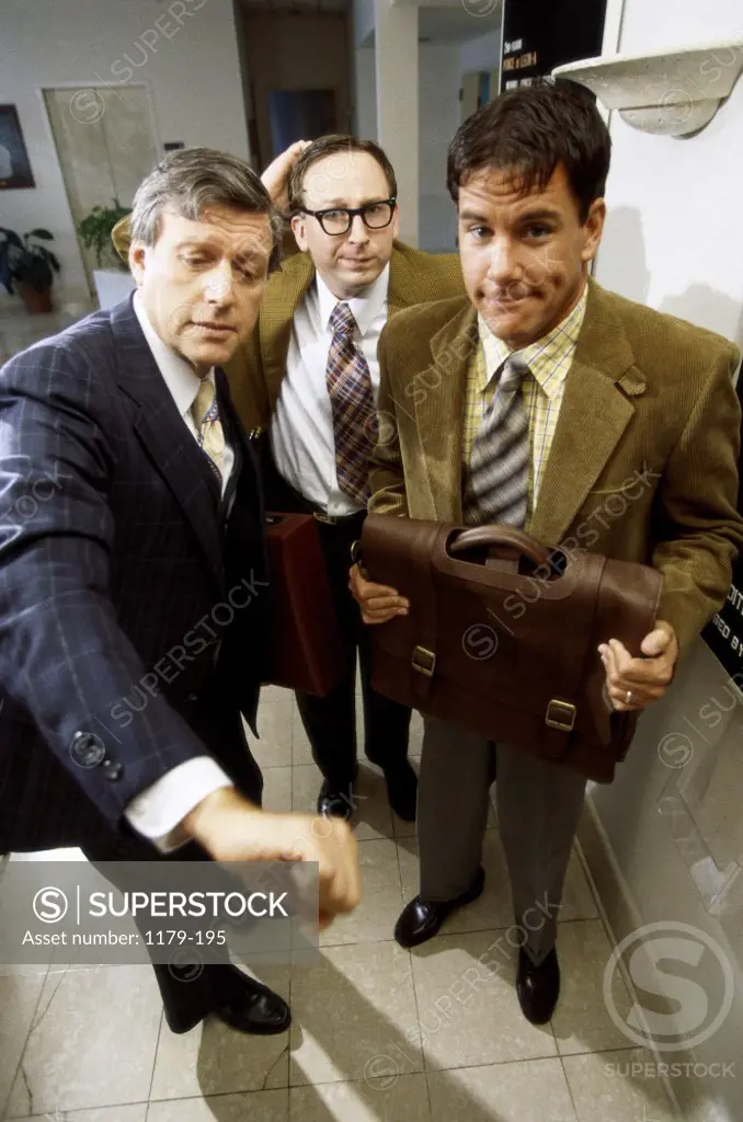 Three businessmen in an office
