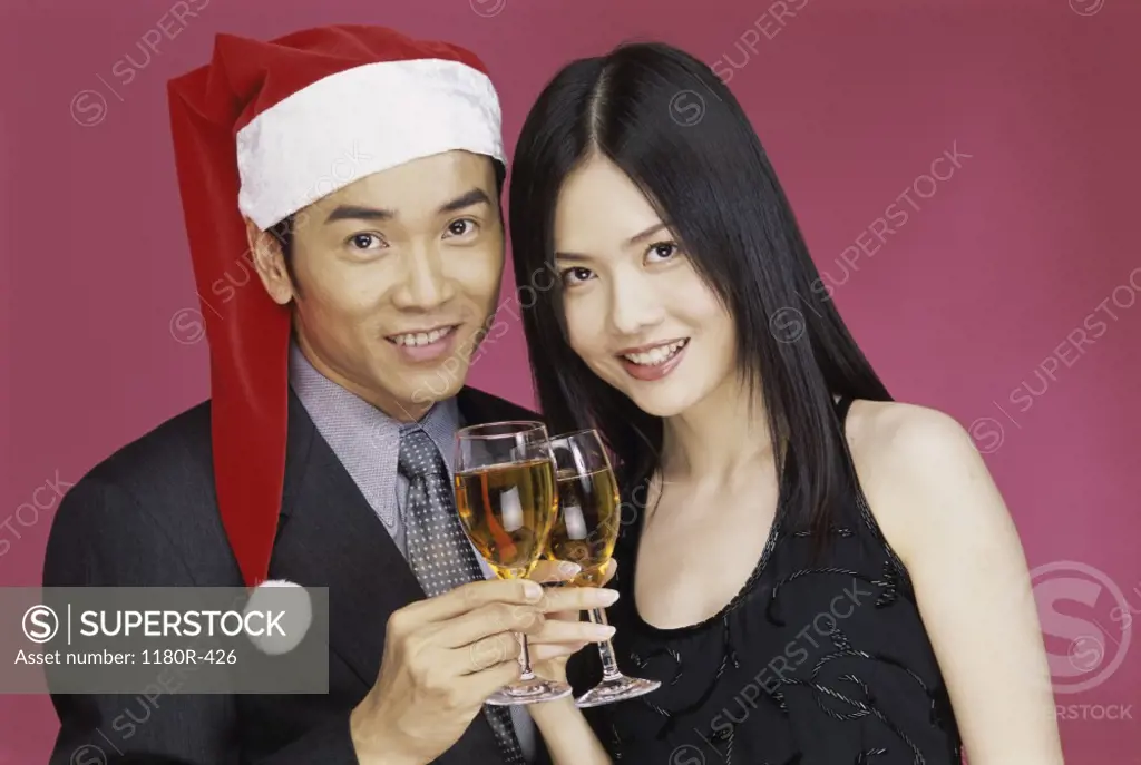Portrait of a young couple holding wineglasses