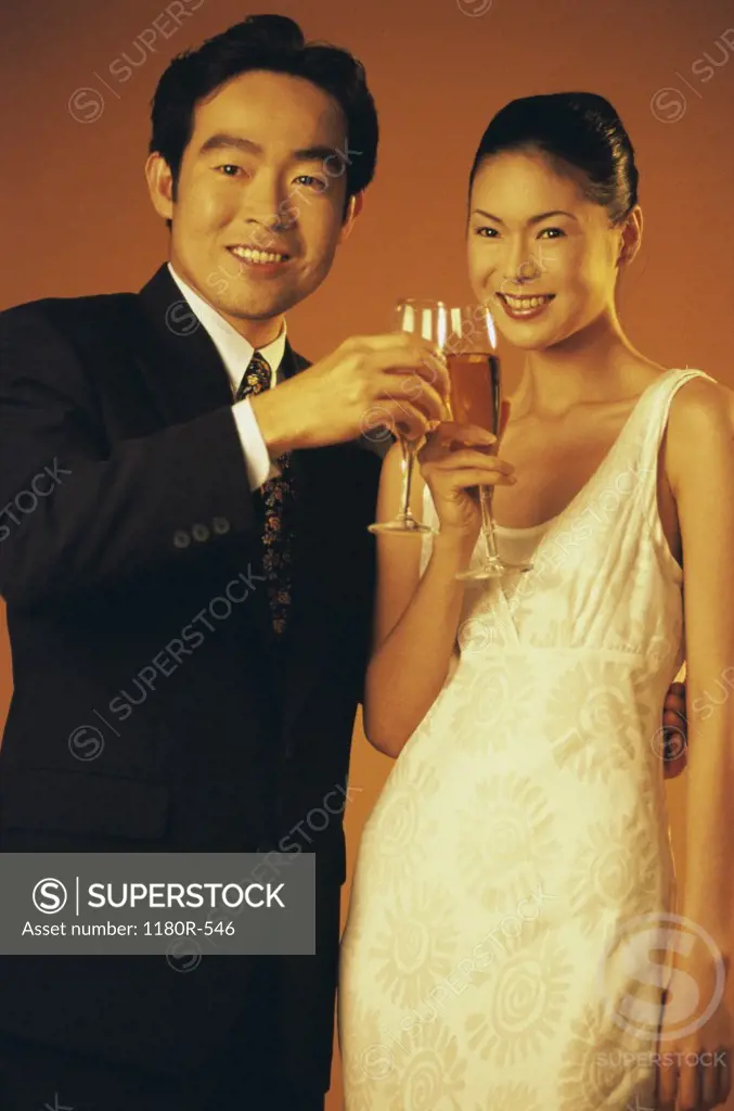 Portrait of a young couple toasting