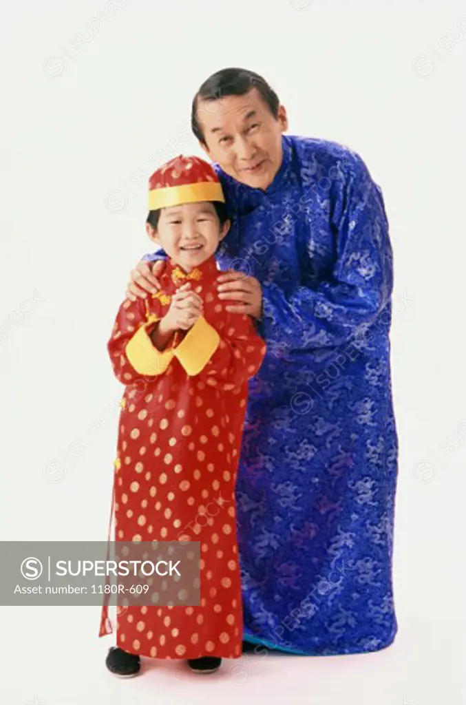 Portrait of a father and his son in traditional clothing