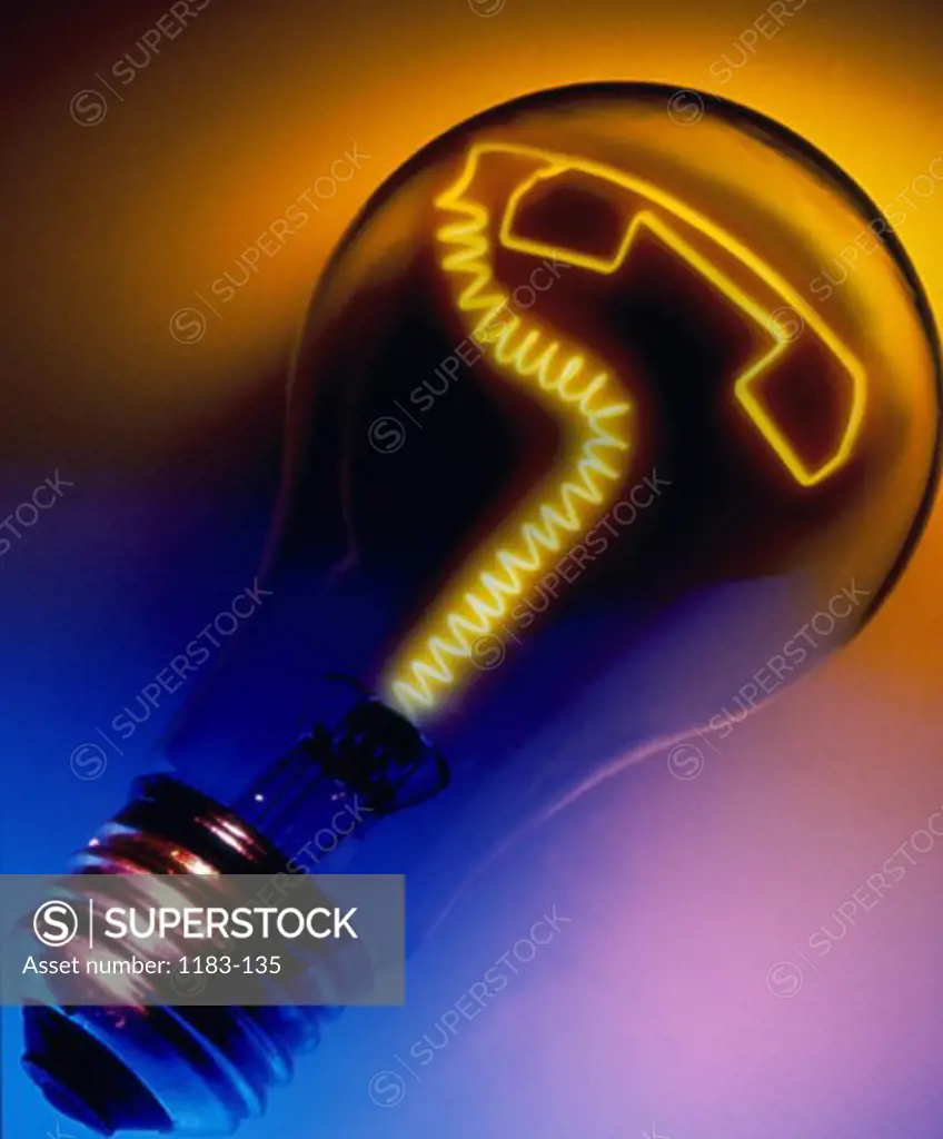Close-up of a light bulb with a telephone receiver shaped filament