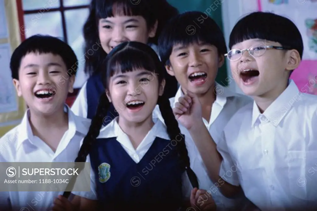 Portrait of a group of children laughing