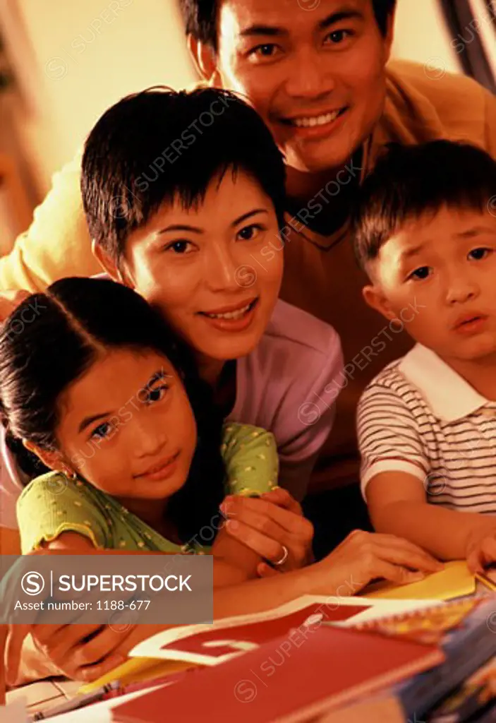 Portrait of a mid adult couple with their son and daughter