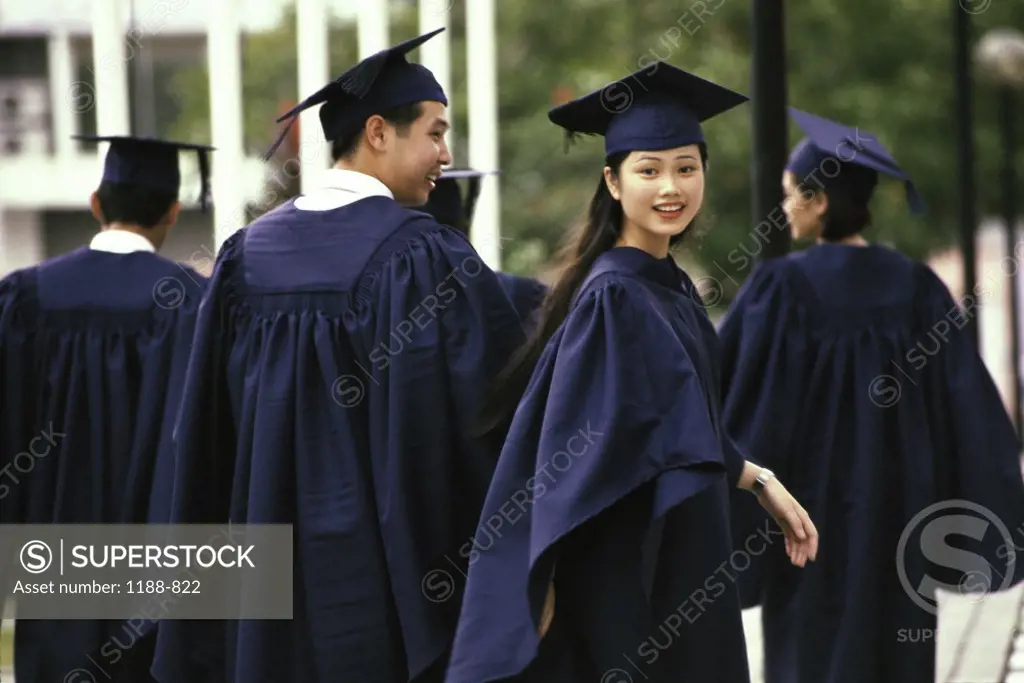 Rear view of a group of young graduates