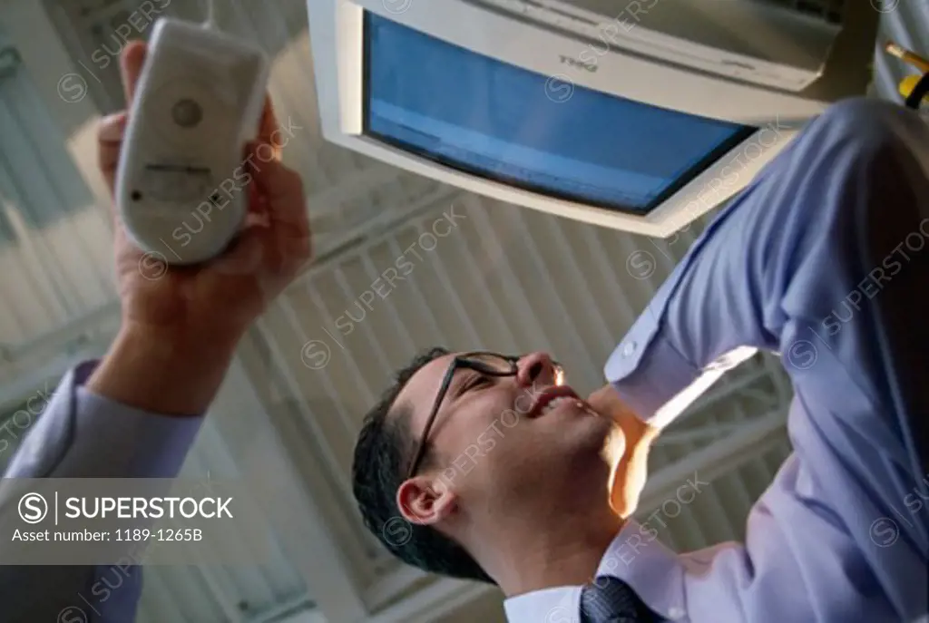 Low angle view of a businessman using a computer