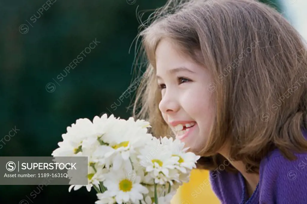 Side profile of a girl holding a bouquet of flowers