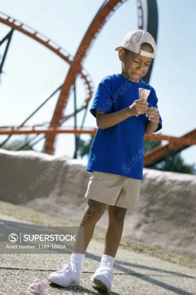 Boy crying after dropping ice cream