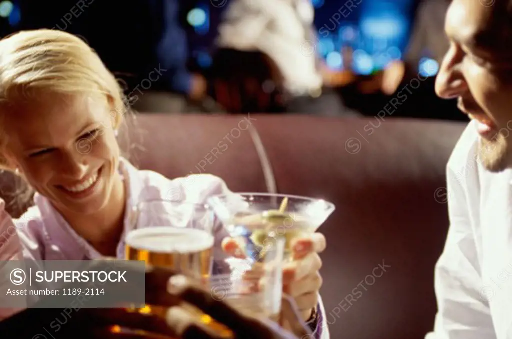 Young couple drinking at a bar