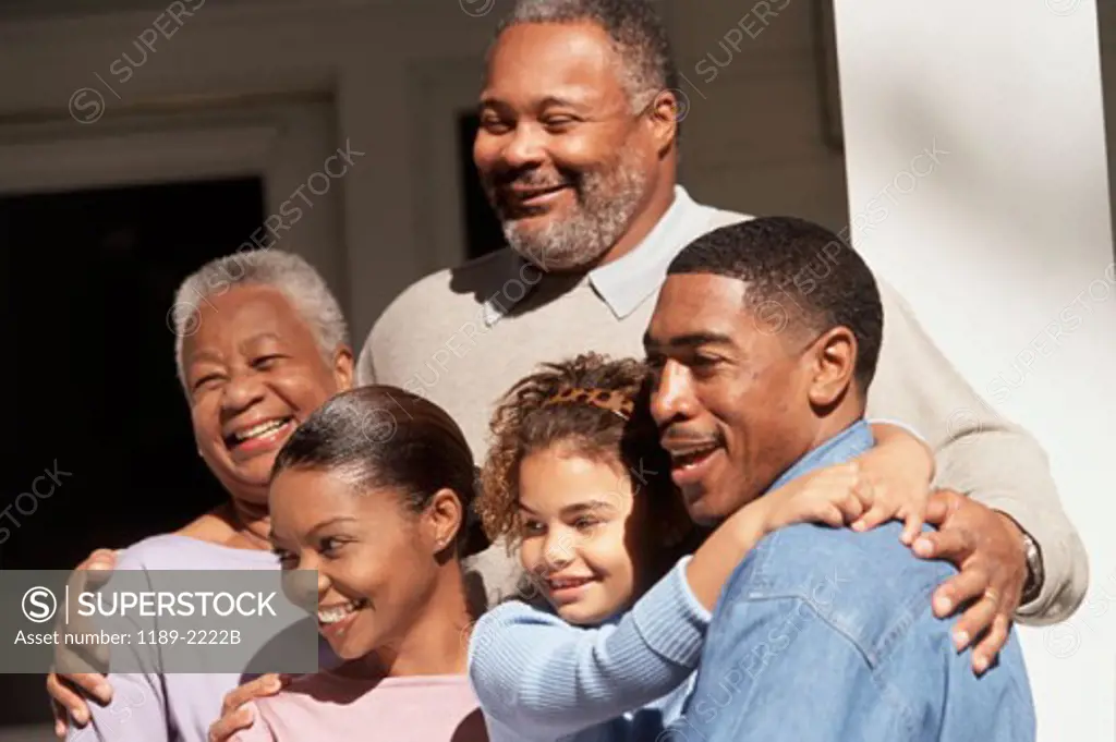 Close-up of a three generation family smiling