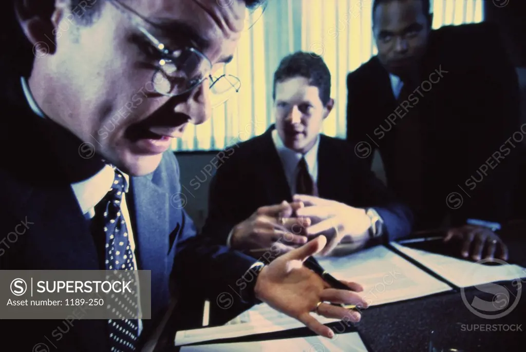 Three businessmen in a meeting
