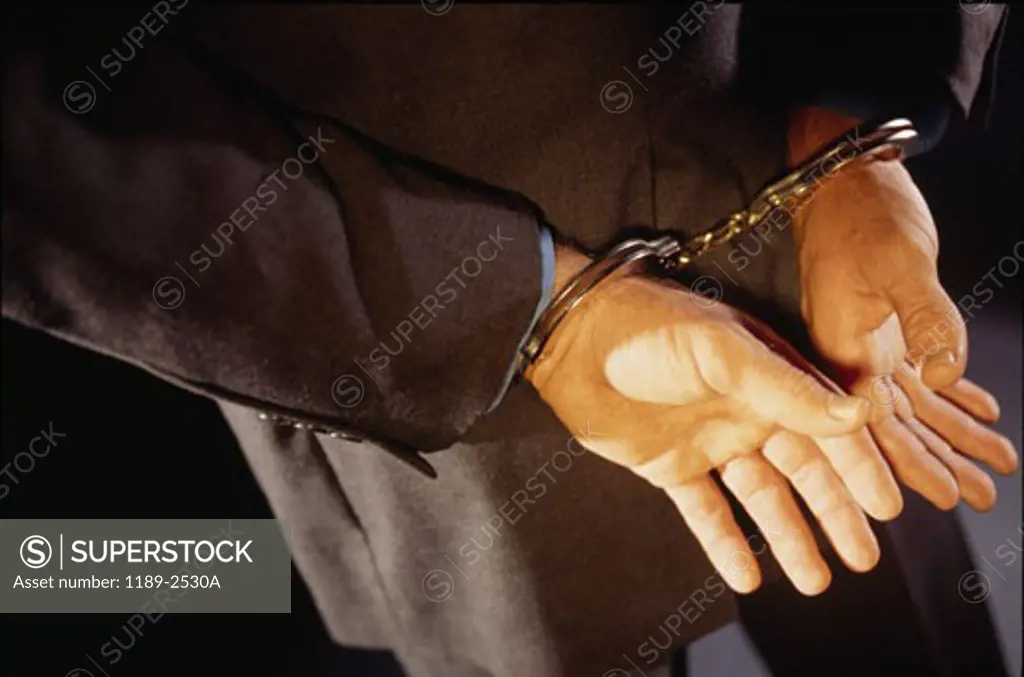 Close-up of a man in handcuffs