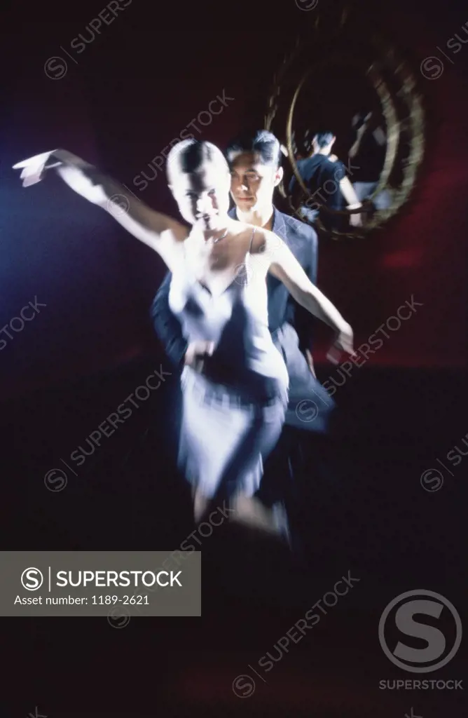Young couple dancing in a nightclub