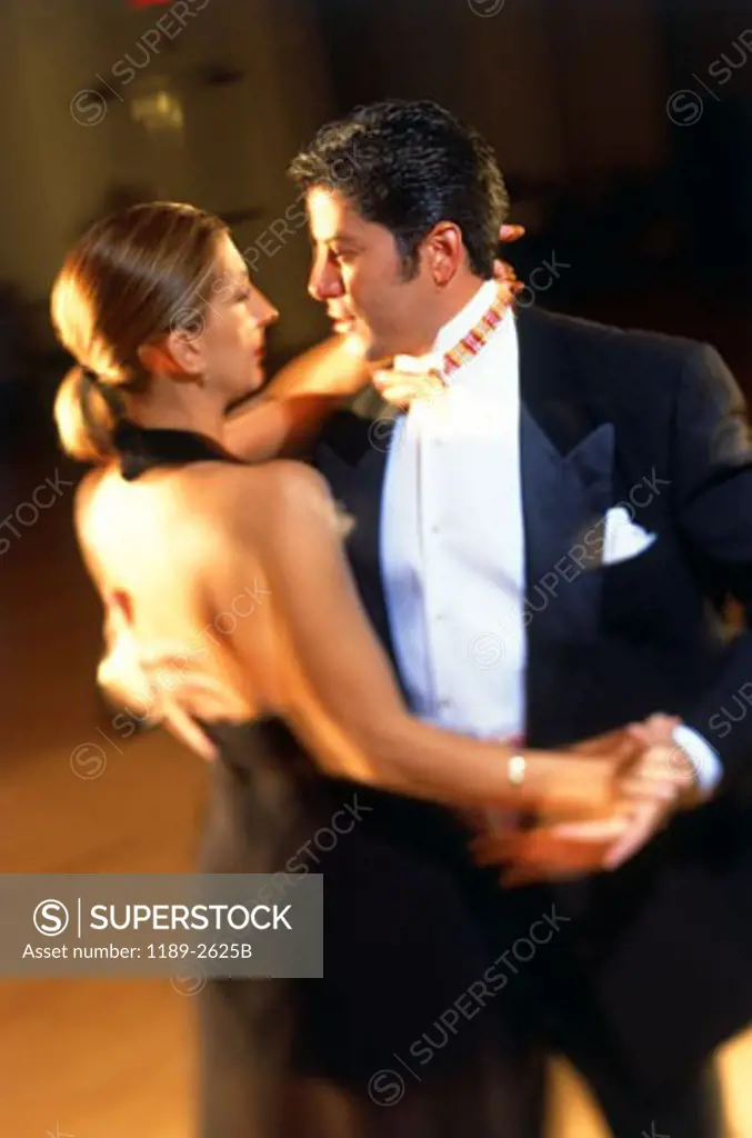 Young couple dancing in a nightclub