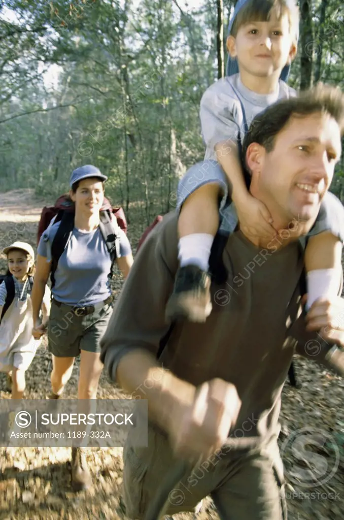 Parents hiking with their son and daughter
