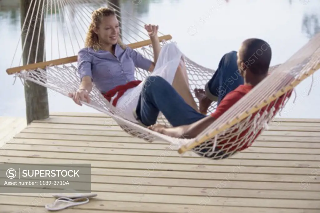 Young couple lying in a hammock